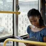 Woman reading in a bus, make time to read!